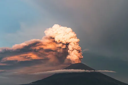 smoke and volcanic ash plume in the atmosphere